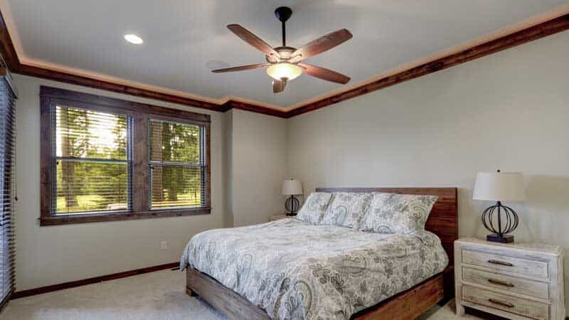 ceiling fan over bed